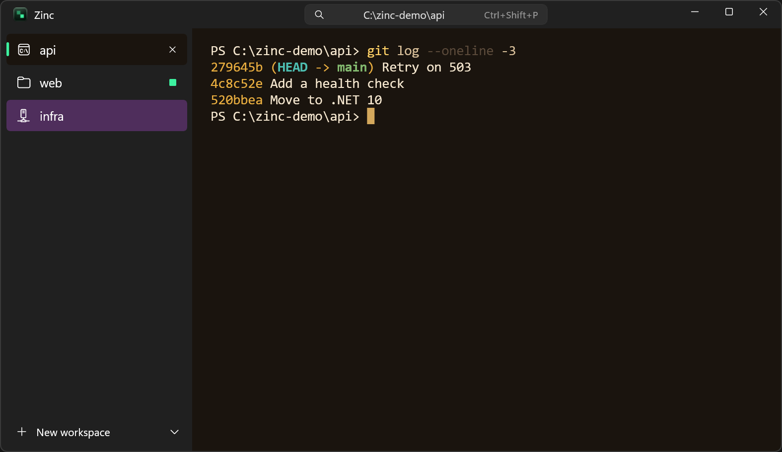 Zinc in the Nightfall scheme, with workspaces in the sidebar and a PowerShell git log