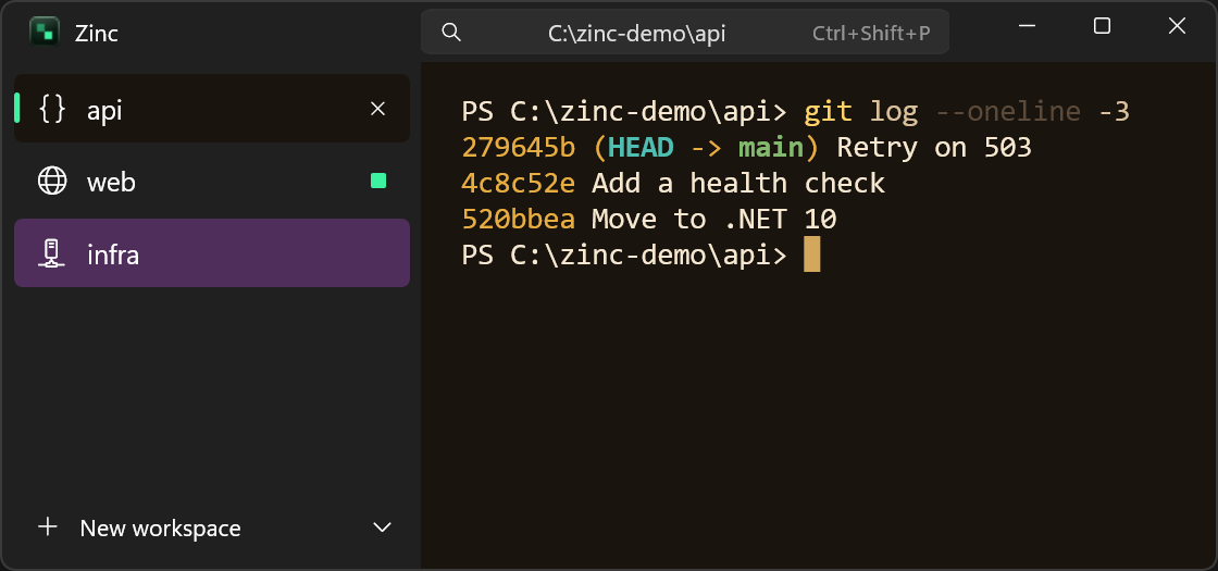 Zinc in the Nightfall scheme, with workspaces in the sidebar and a PowerShell git log